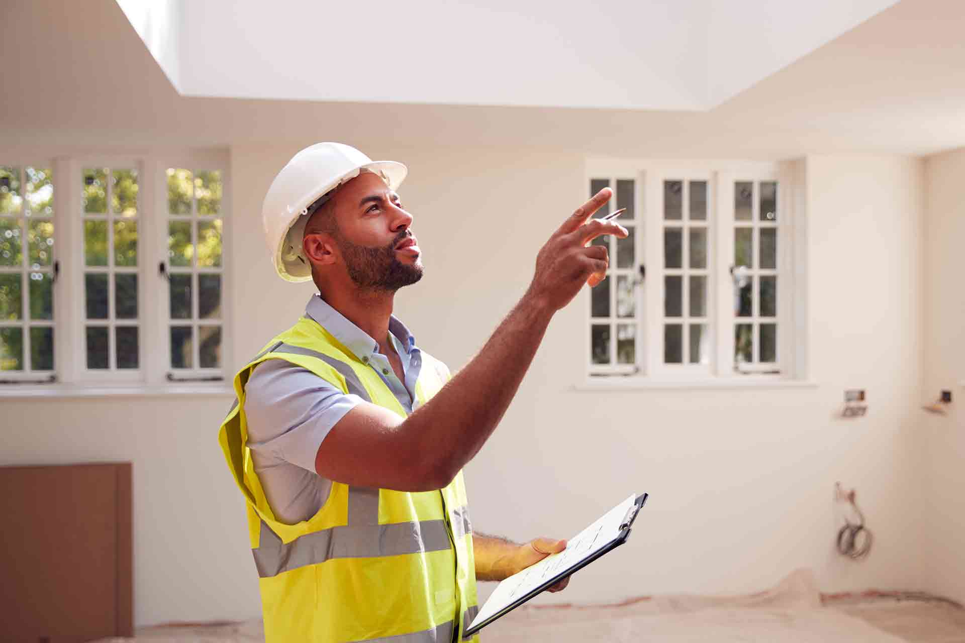 Third Party Wall Surveyors Reading reviewing plans between two parties during a dispute